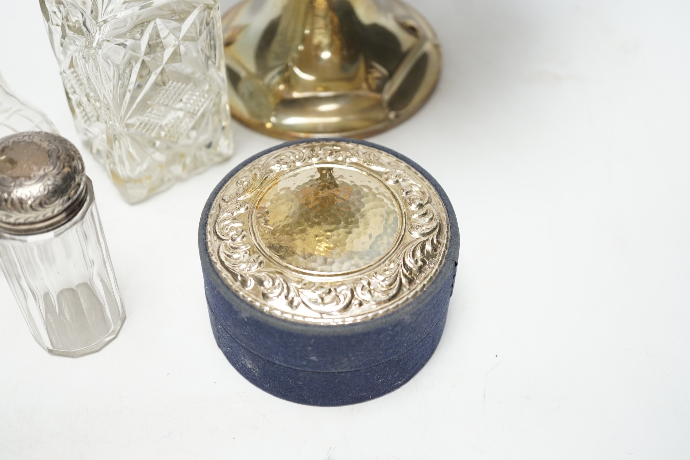 A WMF tazza, 21cm high, and five bottles, two with silver collars, and a cylindrical box